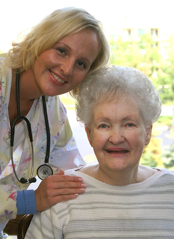 Nurse with a woman smiling