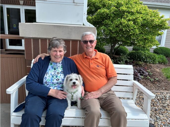 Residents Rob and Lynne with their Jack Russell Terrier, “Trini.” 