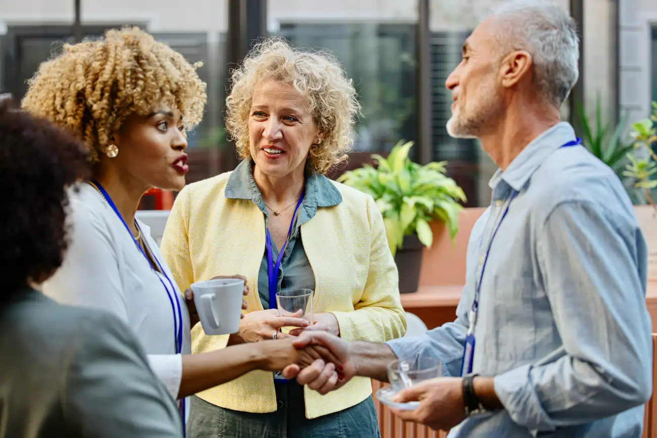 a group of people standing and talking outside